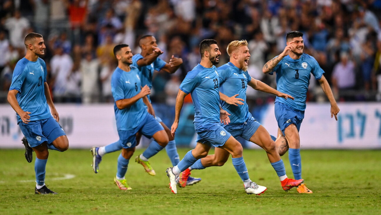 Israeli players on the country’s under-21 team celebrate a victory in the UEFA European U21 Championship playoff round against the Republic of Ireland at Bloomfield Stadium in Tel Aviv, Sept. 27, 2022. (Seb Daly/Sportsfile via Getty Images)