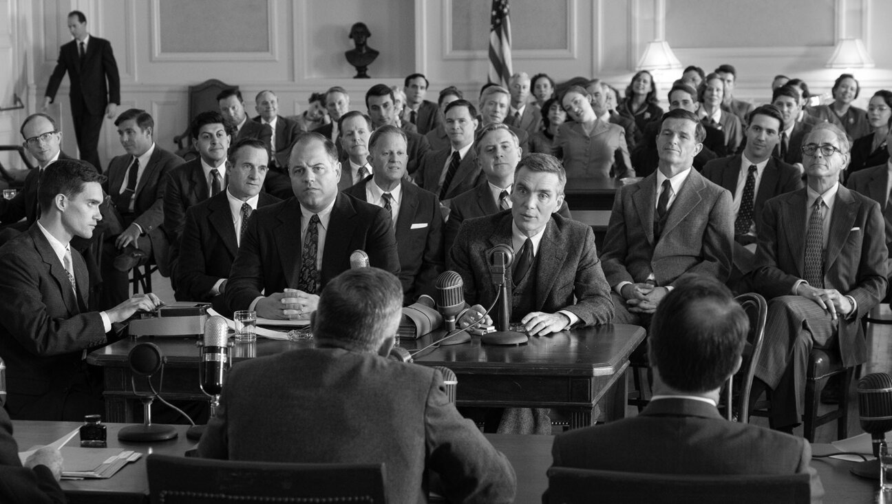 In a key scene in <i>Oppenheimer,</i> the physicist embarrasses Strauss before the Joint Committee on Atomic Energy, prompting Strauss' crusade to humiliate Oppenheimer.
