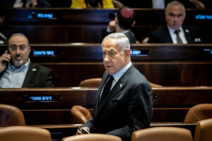 Israeli Prime Minister Benjamin Netanyahu seen during a discussion and a vote in the assembly hall of the Knesset, the Israeli parliament in Jerusalem, March 22, 2023. (Yonatan Sindel/Flash90)