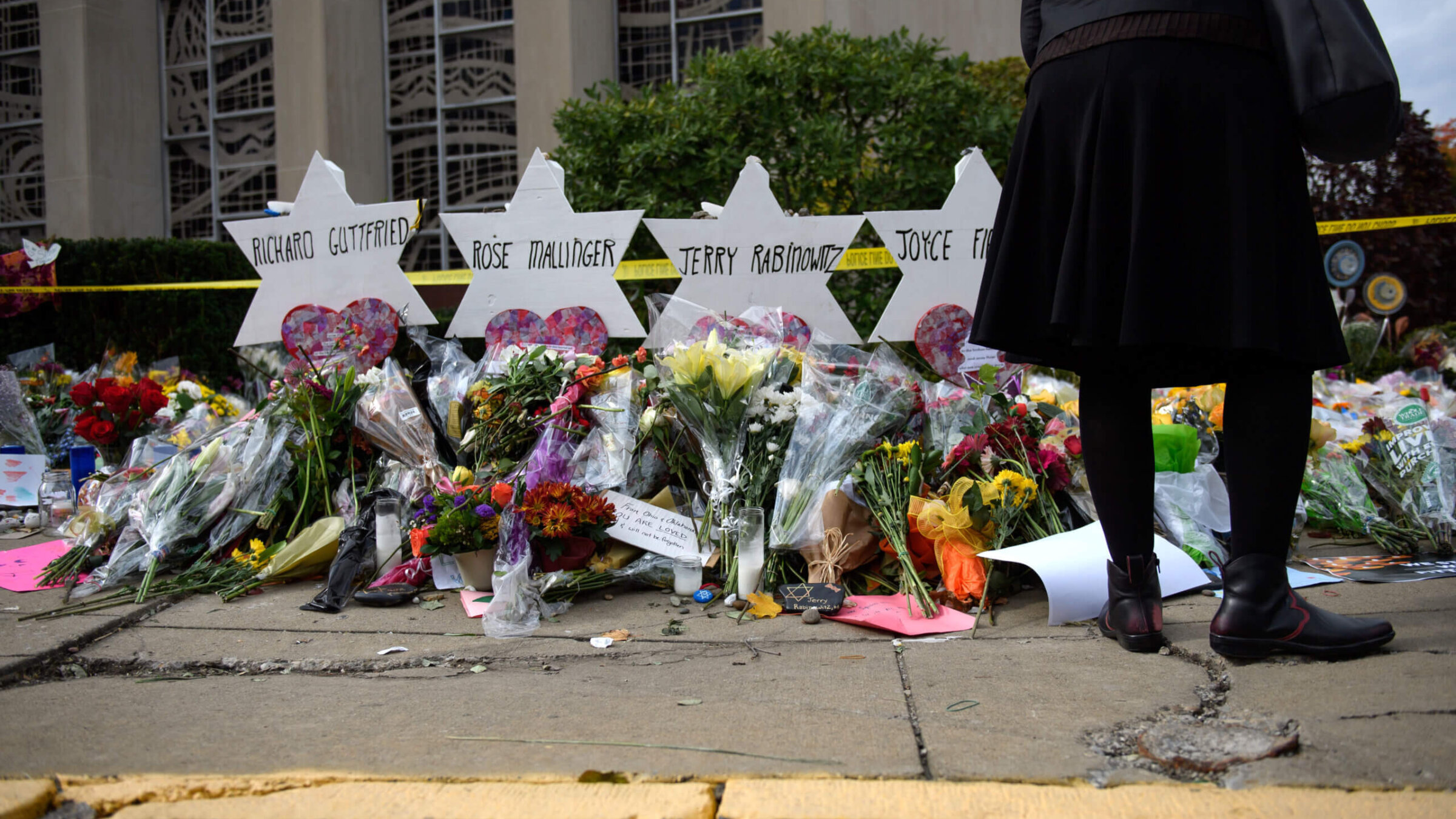 Mourners visit the memorial outside the Tree of Life Synagogue on October 31, 2018, in Pittsburgh, Pennsylvania, where eleven Jews were killed in a mass shooting.