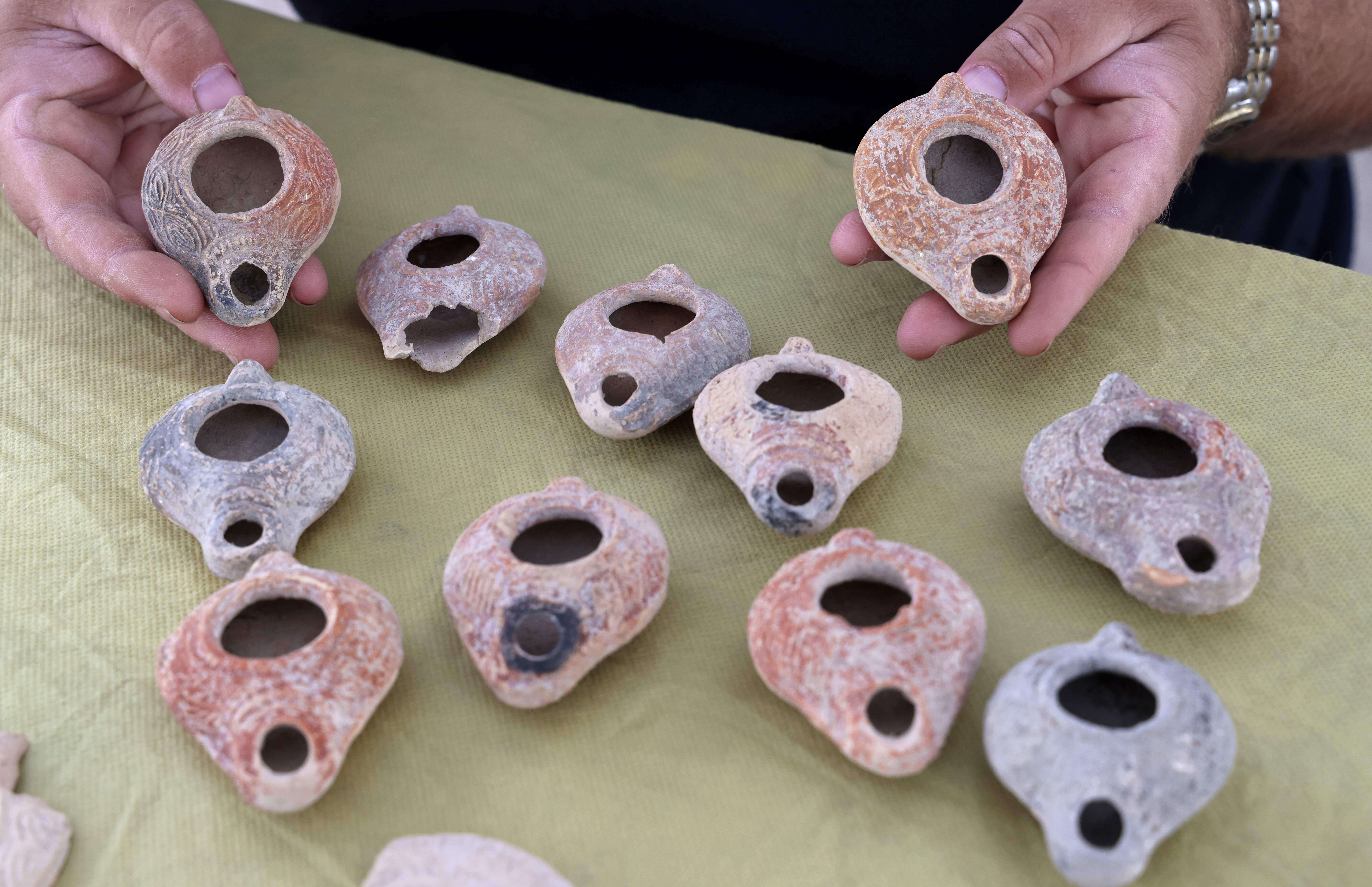 Ceramic oil lamps unearthed at the archaeological site in the Israeli city of Bet Shemesh, in 2020.