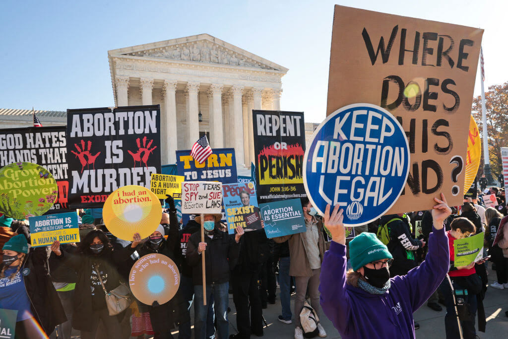 Demonstrators rallied for and against abortion access in 2021 as the Supreme Court heard arguments in the <i>Dobbs v. Jackson</i> case, which would ultimately strike down a constitutional right to abortion.