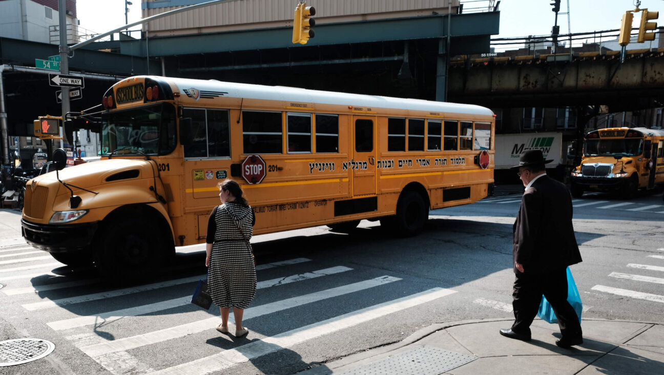 A yeshiva school bus drives through Brooklyn.