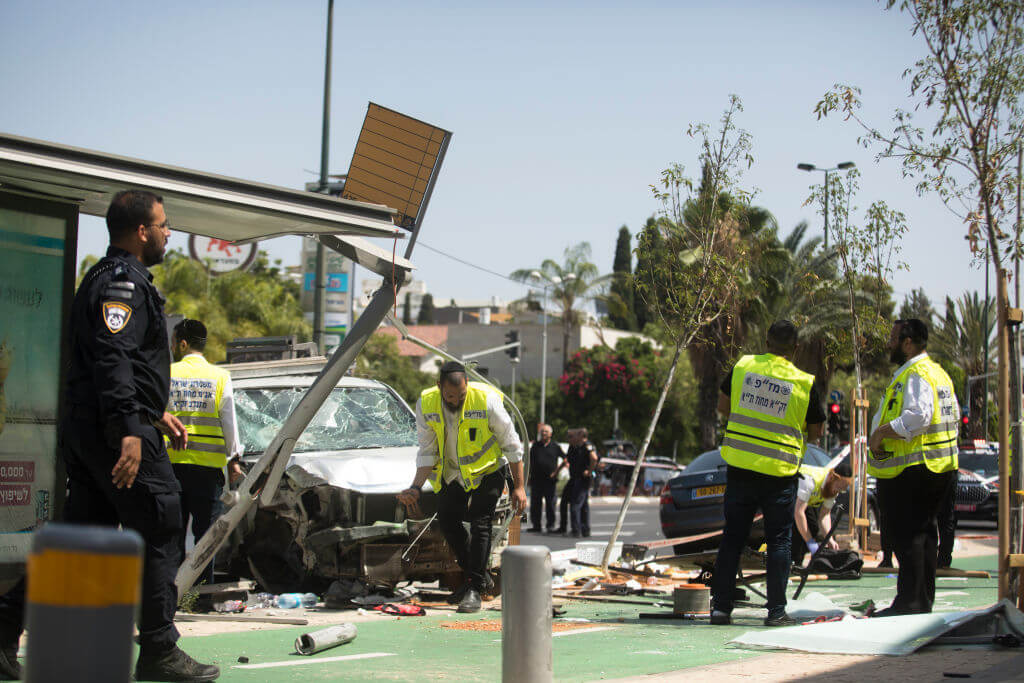 Israeli security and rescue forces examine the scene of a terror attack on July 4, 2023 in Tel Aviv.