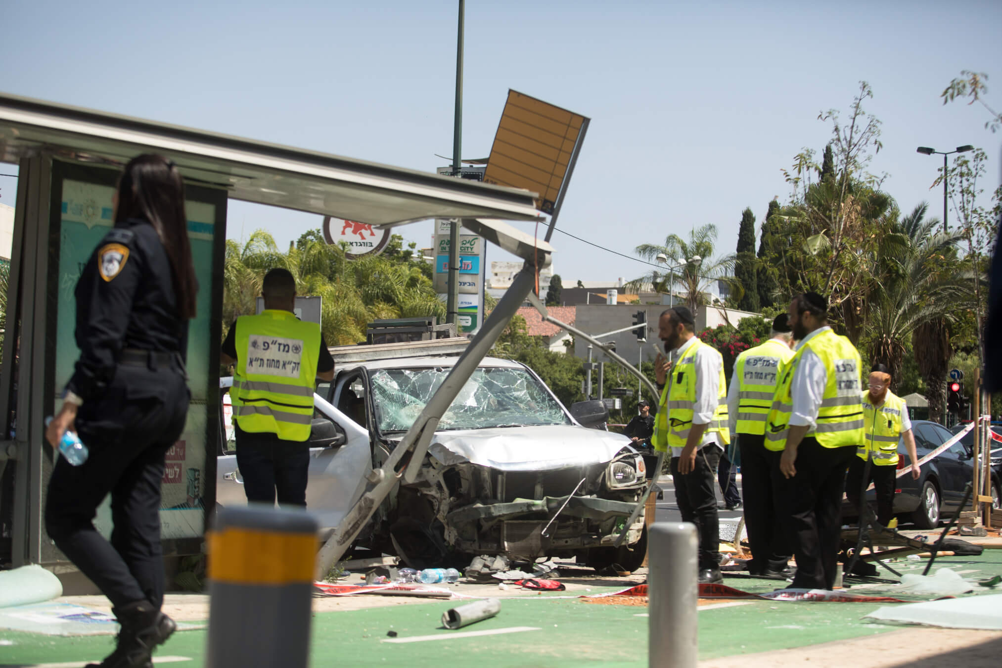 Israeli security and rescue forces examine the scene of a terror attack on July 4, 2023 in Tel Aviv, Israel. Seven people were injured after a car rammed into pedestrians, the driver then stabbed several people before being neutralised, according to Israeli officials. 