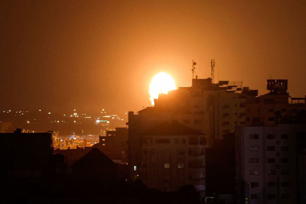 Smoke and flames rise above buildings after Israeli air airstrikes in Gaza City, on July 5, 2023. Israel carried out air strikes on the Gaza Strip in response to rockets fired from the Palestinian coastal enclave, the army said. 