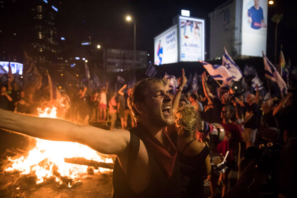 Israelis block a main highway during a demonstration against the Israeli government on July 5, 2023 in Tel Aviv.