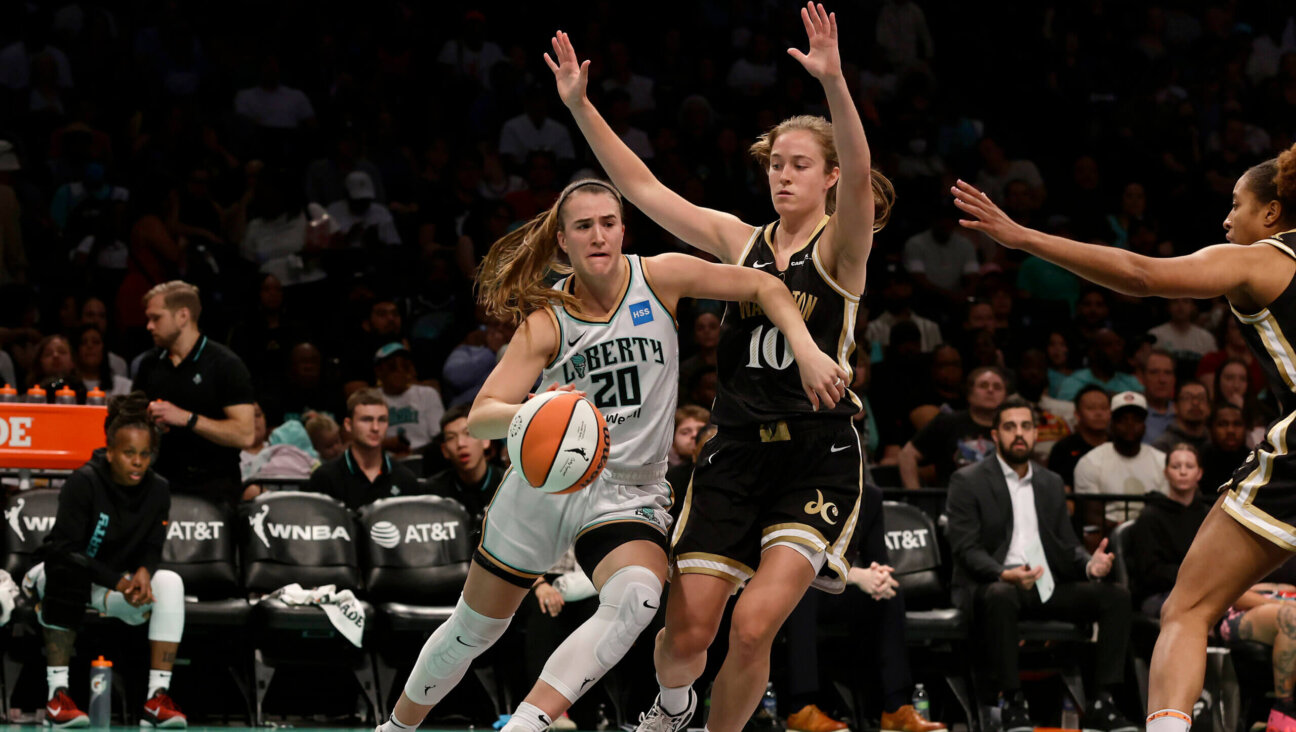 Abby Meyers defends Sabrina Ionescu of the New York Liberty in a June game in New York City. The Liberty defeated the Mystics in overtime, 89-88.