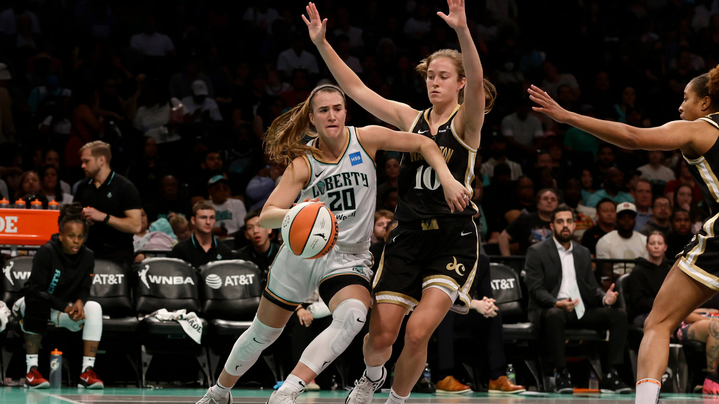 Abby Meyers defends Sabrina Ionescu of the New York Liberty in a June game in New York City. The Liberty defeated the Mystics in overtime, 89-88.