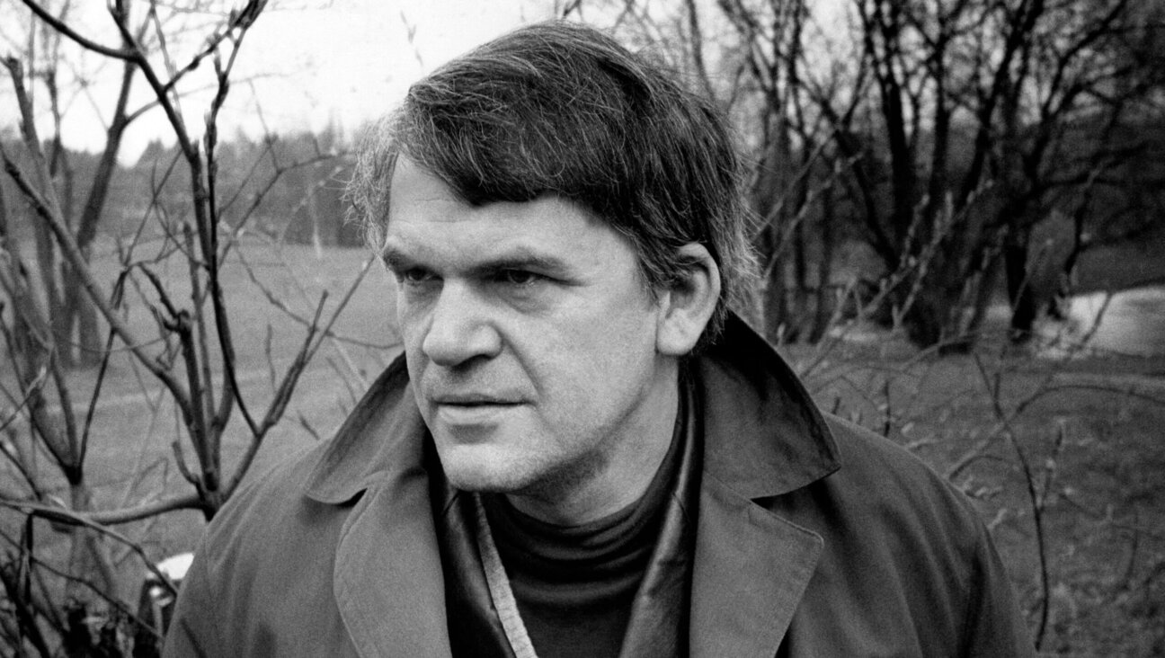 Milan Kundera poses in a garden in Prague, circa 1973.