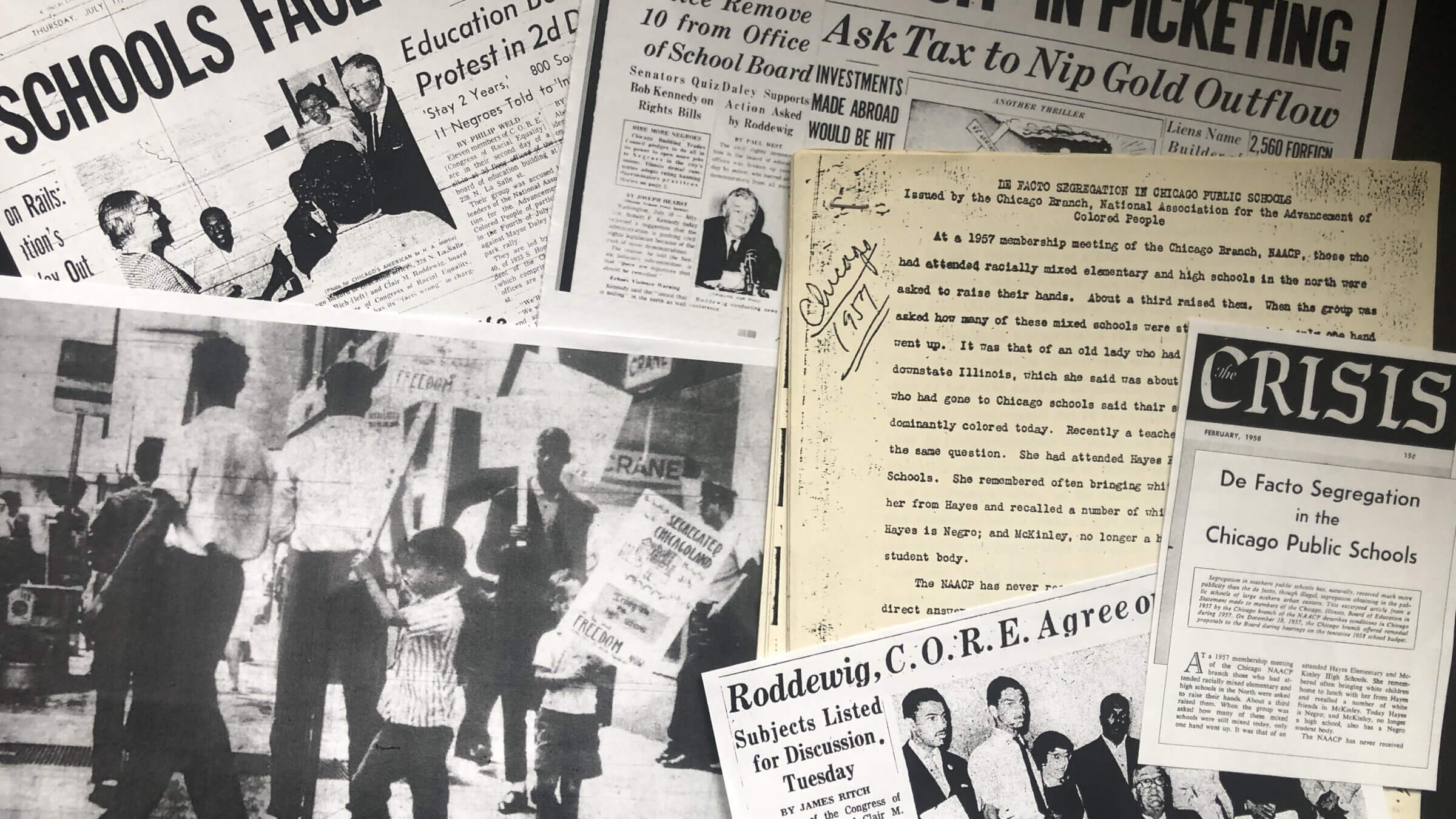 A scrapbook of memorabilia from the 1963 Congress of Racial Equality's sit-in at the Chicago Board of Education headquarters. Robin Washington, then 6, carries the large protest sign in the photo.