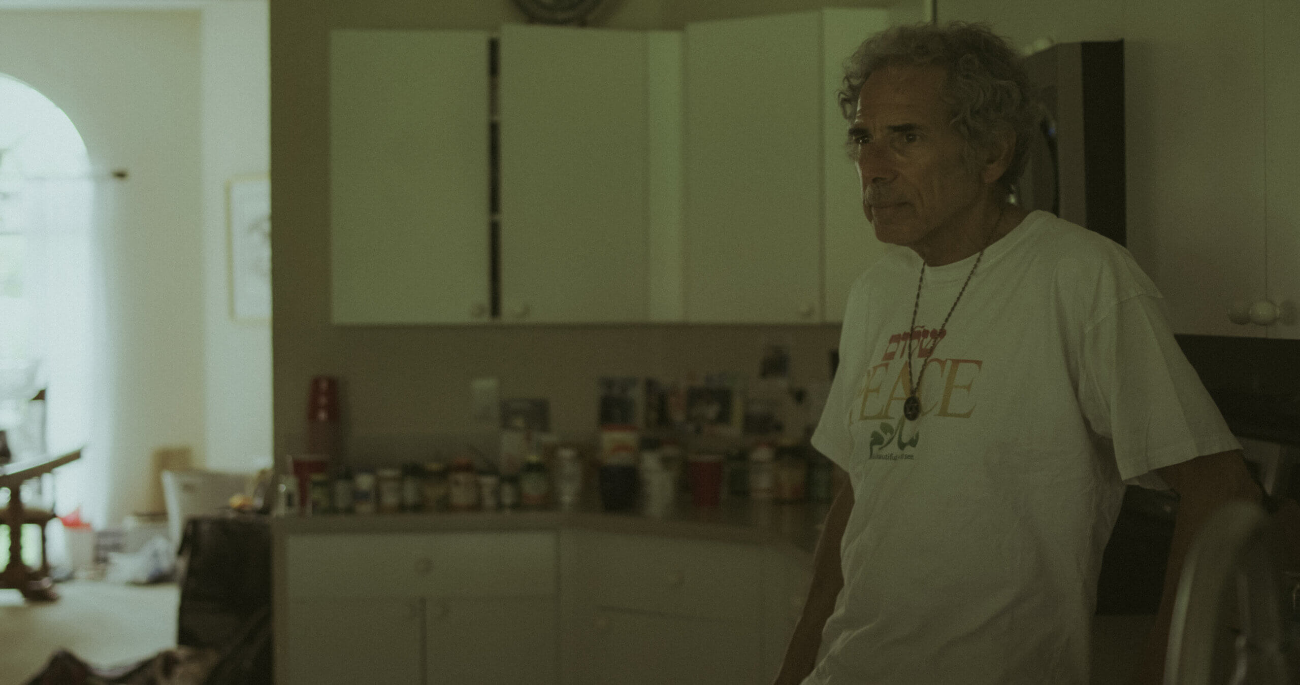 A still photo showing Rabbi Barry Silver, a pro-choice activist based in Florida, standing in a kitchen.