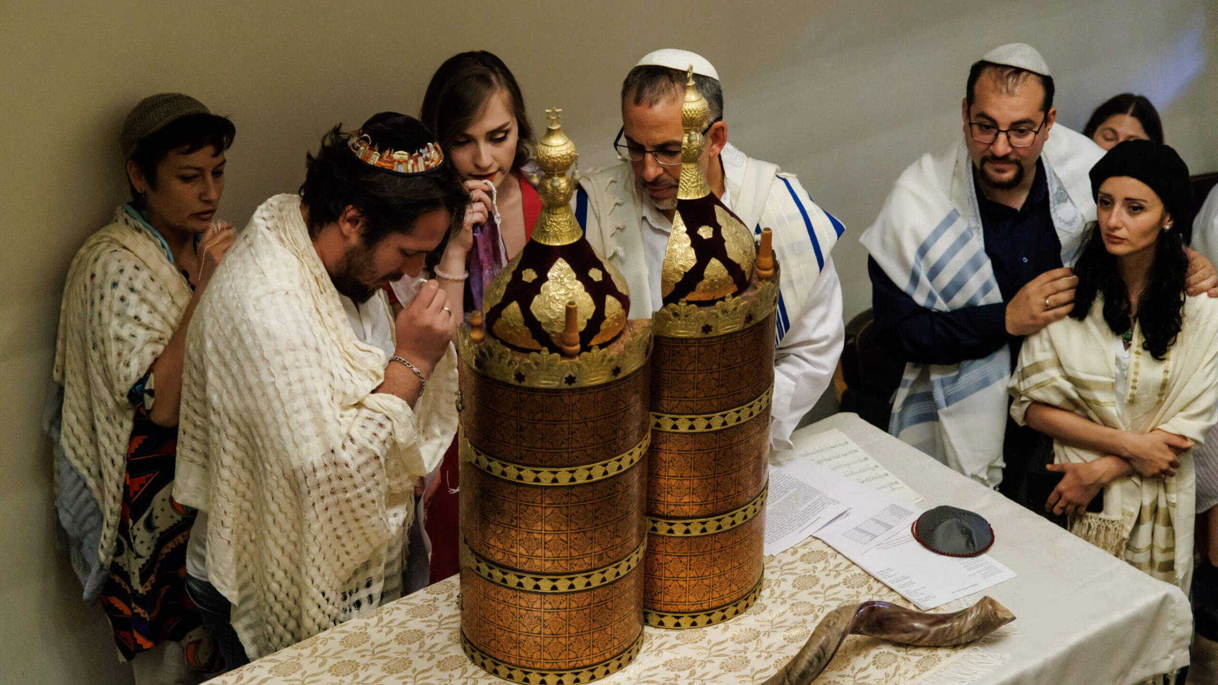 During the first b'nai mitzvah at Tbilisi's  Peace Synagogue, Nina Mgeladze, center, was one of the first women to read Torah in Georgia's 2,600 years of Jewish history. Rabbi Golan Ben-Chorin of Haifa, to her left, ls the nascent congregation's spiritual leader. At right are Misha Grishashvili, the synagogue's founding president, and his wife, Keti Chikviladze, director of Georgia's Hillel, both of whom also became b'nai mitzvah.