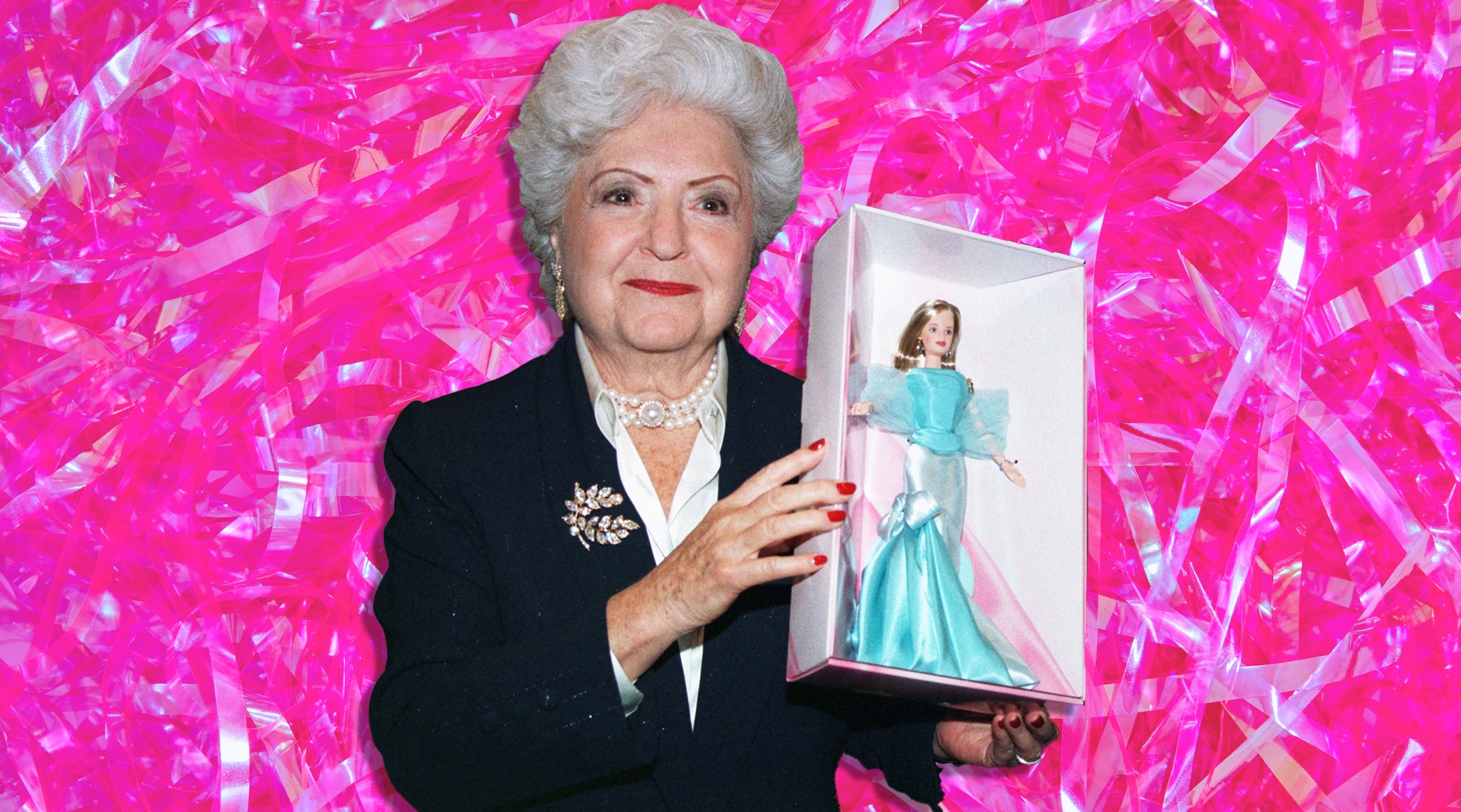 Ruth Handler holds a Barbie that was created for the doll’s 40th anniversary in 1999. (Jeff Christensen/Getty Images)