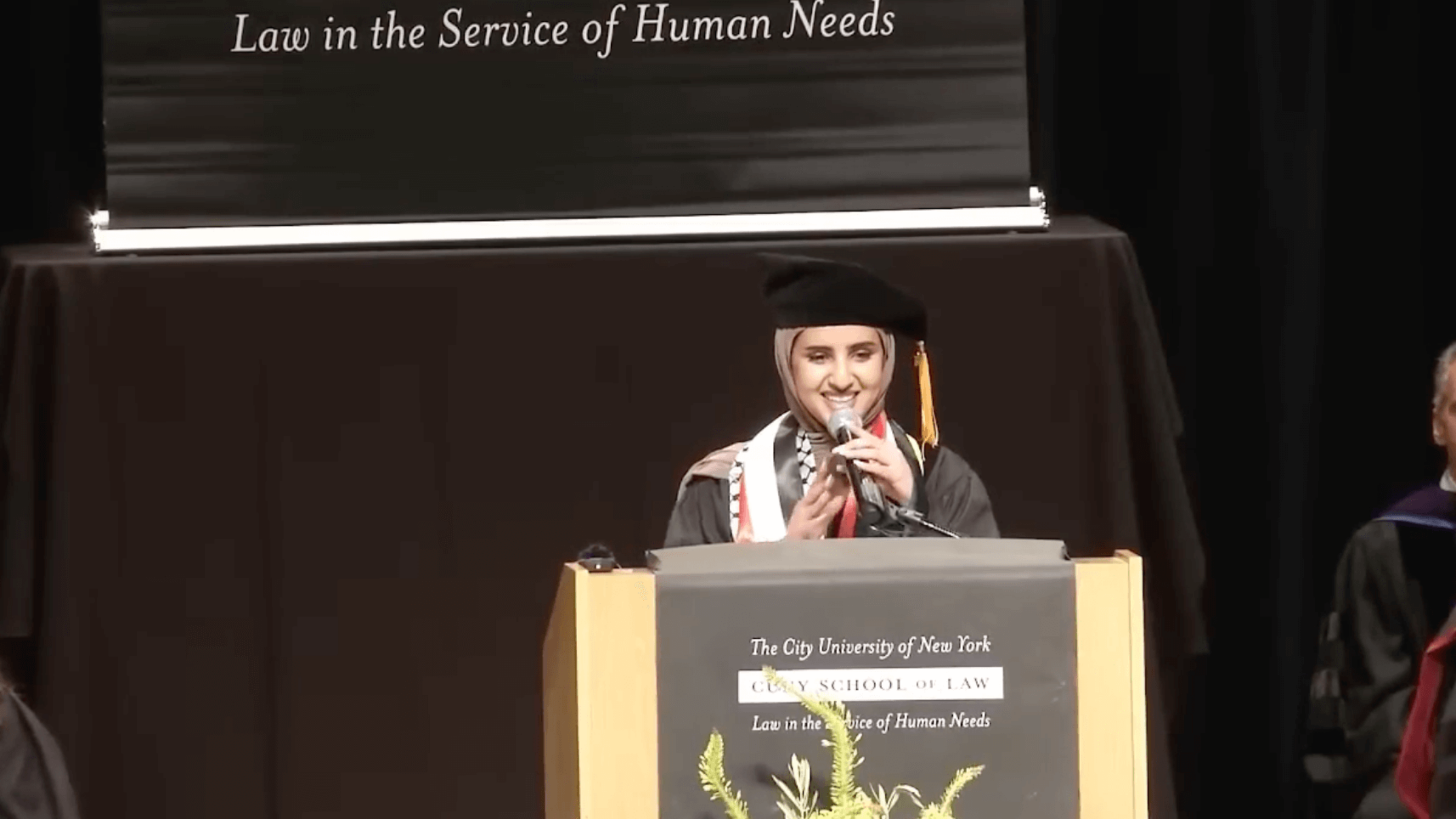 CUNY School of Law speaker Fatima Mousa Mohammed speaking at commencement on May 12, 2023. 