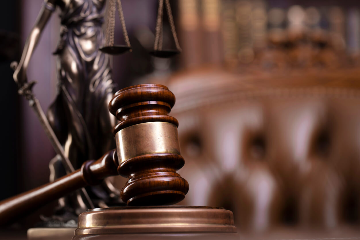 A judge's gavel in a courtroom.