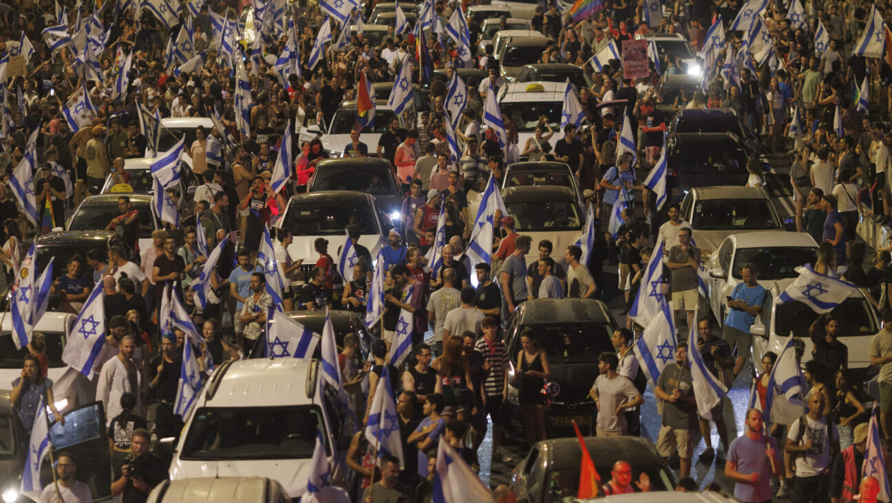 Protestors block a road during a demonstration against the judicial reform bill outside the Knesset, Israel's parliament, in Jerusalem, Israel, on Monday, July 24, 2023. Israel's parliament approved a bill that will reduce judges' ability to overrule government decisions and appointments. 