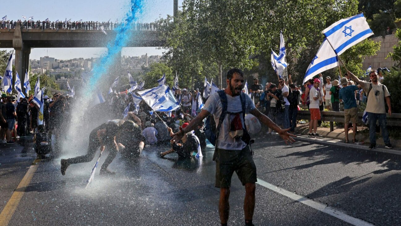Israeli security forces use a water cannon to disperse demonstrators blocking the entrance of the Knesset, Israel's parliament, in Jerusalem on July 24, 2023, amid a months-long wave of protests against the government's planned judicial overhaul. Israel's hard-right government pushed through parliament a key clause of its controversial judicial reform package despite months of mass protests and concerns voiced by foreign allies. 