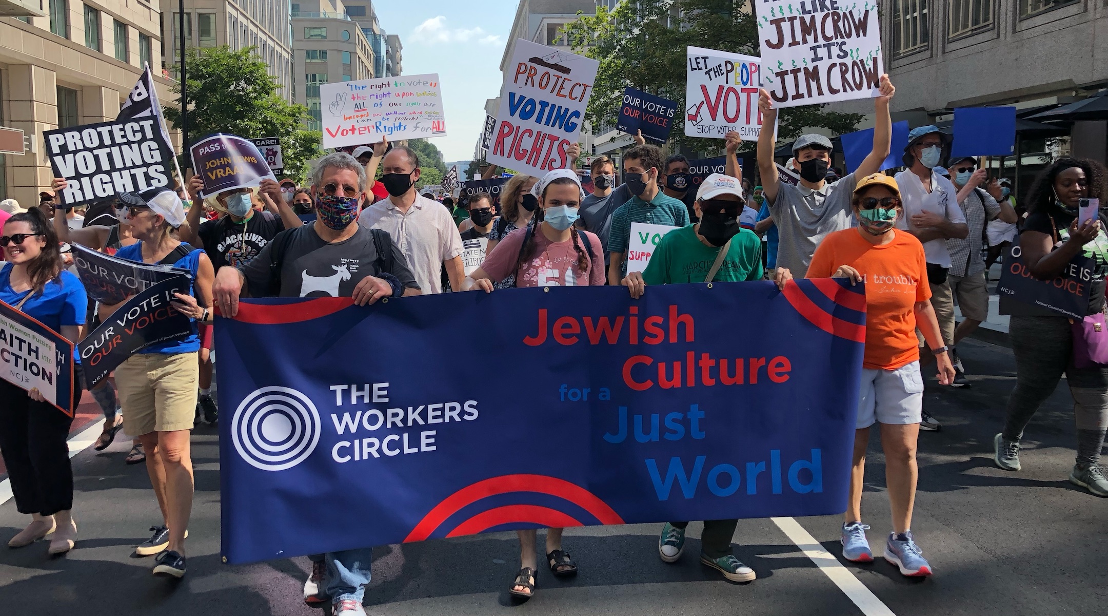 Members of The Workers Circle at a pro-democracy march. The group has announced it will resign from the Conference of Presidents of Major American Jewish Organizations due to what it described as the coalition’s inaction on protecting democracy. (Courtesy of The Workers Circle)