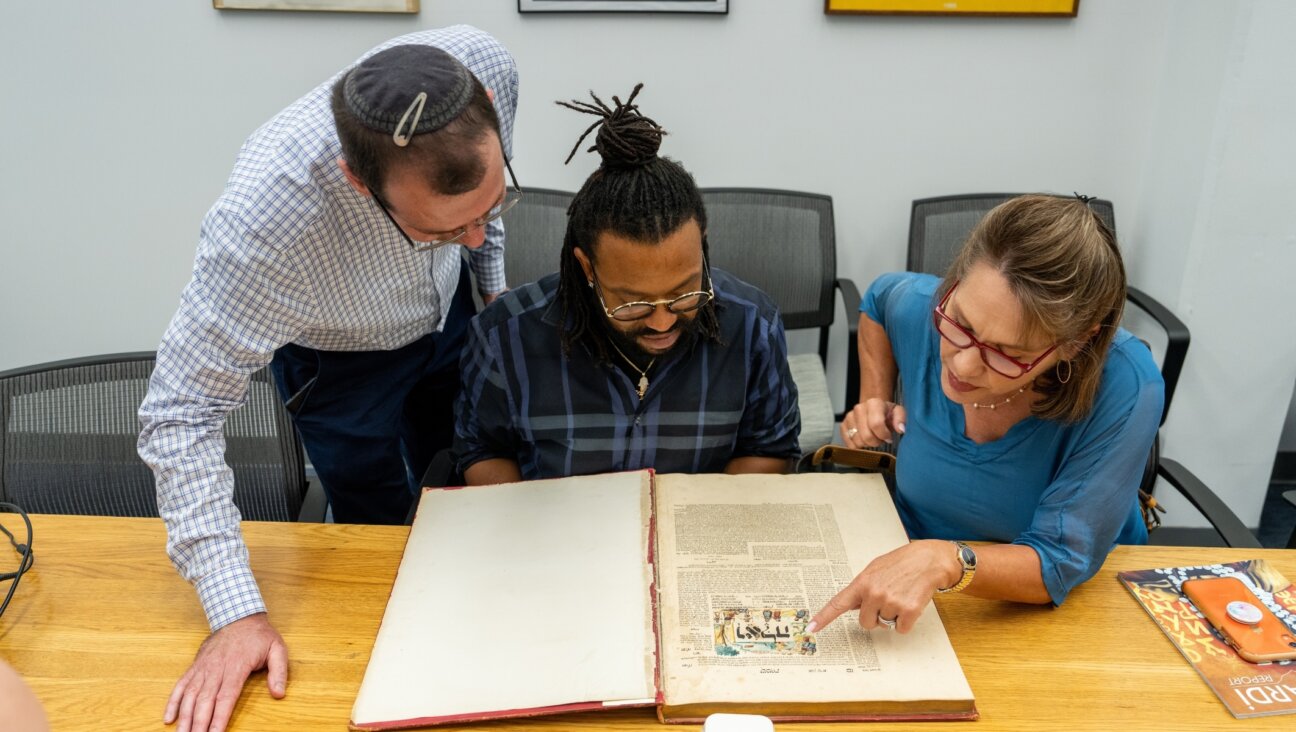 Christian students enrolled in the master’s program for Jewish studies at Yeshiva University read a piece of text from the book of Shemot, or Exodus, while on a tour of the campus guided by Jewish educators. (Courtesy Yeshiva University)