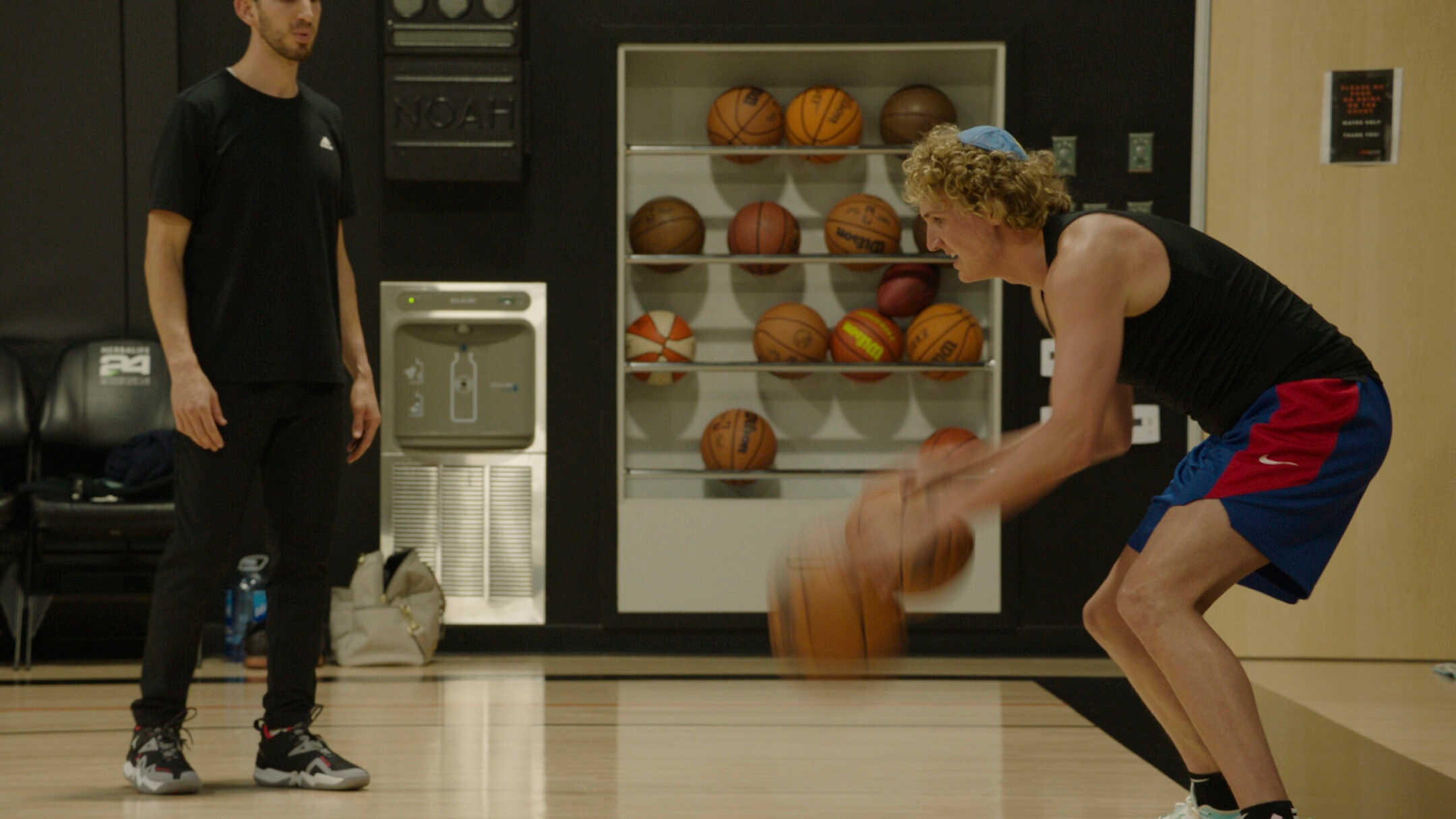 Ryan Turell, the Jewish basketball player who wears a kippah on the court, dribbles in a scene in “Destination NBA: A G League Odyssey.” (Courtesy of Prime Video)