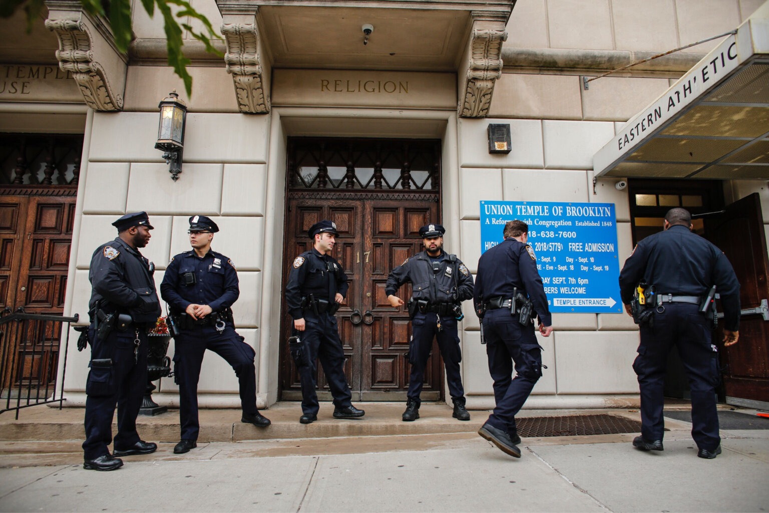New York City police officers guard the door of Brooklyn’s Union Temple in 2018. (Getty)