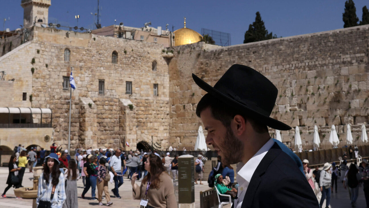 The Western Wall is crowded with tourists and Israelis alike, all far more concerned with religion and prayer than politics.