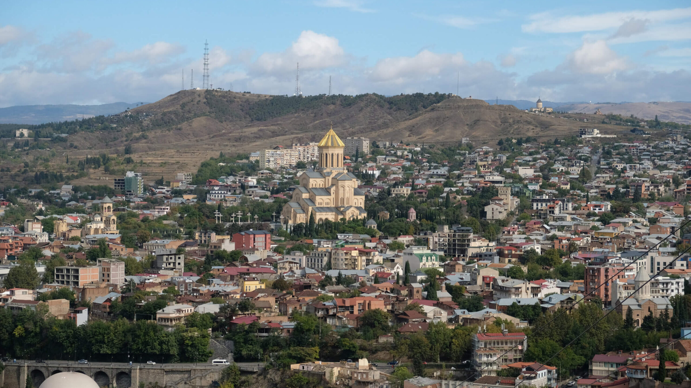 A view of Tbilisi, Georgia, seen from a hilltop.