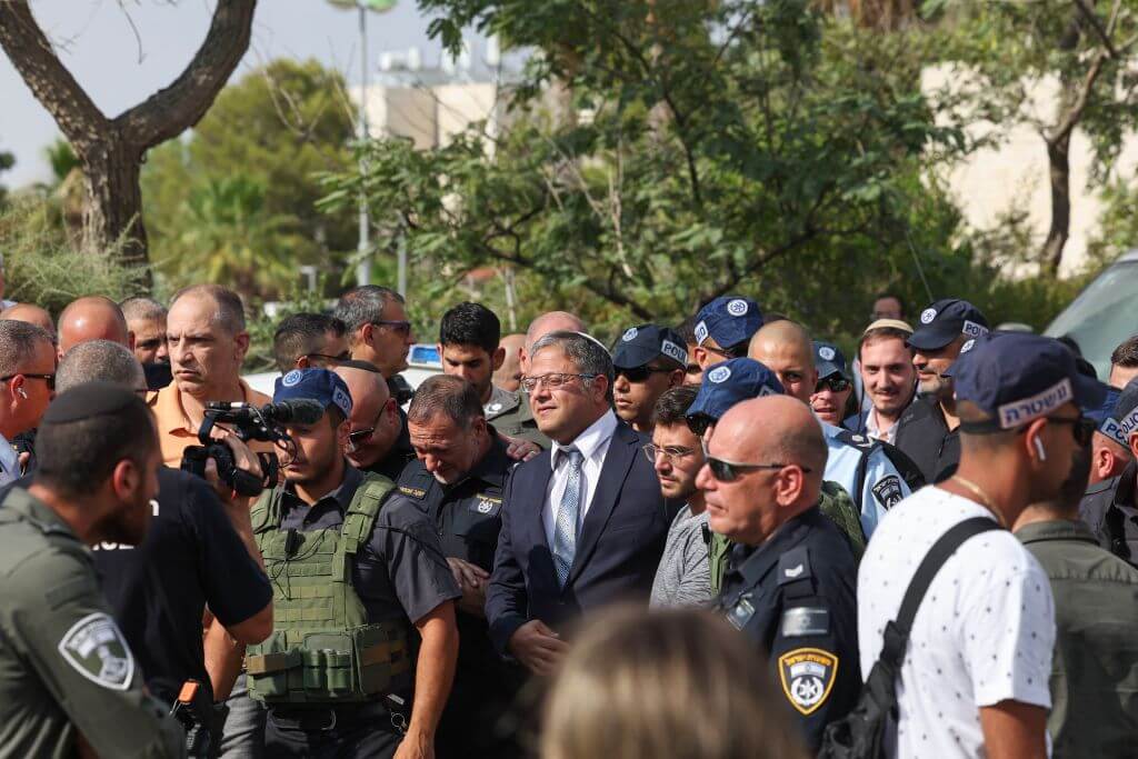 Israel's National Security Minister, Itamar Ben-Gvir, center, arrives to the site of an attack in the Israeli settlement of Maale Adumim in the occupied West Bank, on August 1, 2023.