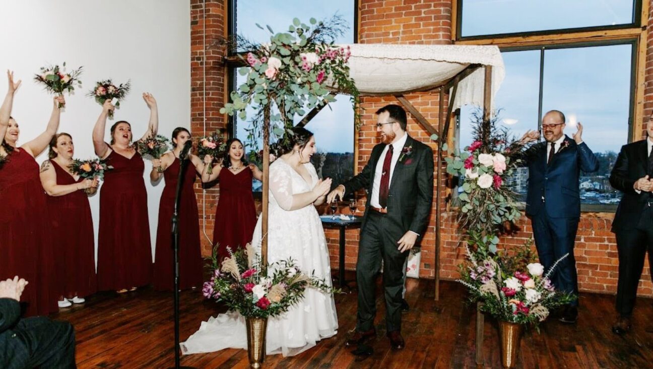 The wedding of Molly Kazin, who is Jewish, and Evan Marshall, who is not, in Holyoke, Massachusetts, on Nov. 20, 2021. Though Kazin grew up in a Conservative congregation, she assumed she could not get a rabbi in the movement to preside at her wedding, and found one through the group where she works, 18Doors, which supports relationships between Jews and non-Jews.