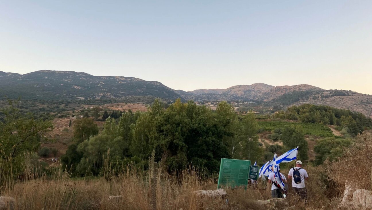 Police blocked the entry to Neve Ativ, where Netanyahu was staying on vacation, so protesters began to hike several kilometers up the mountain toward the village. Neve Ativ is visible in the distance.