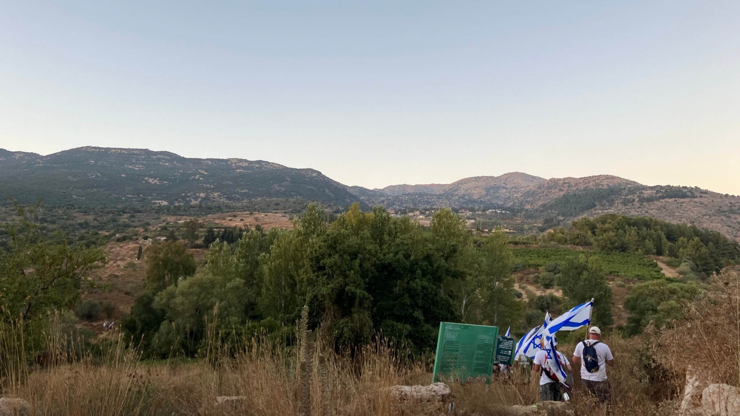 Police blocked the entry to Neve Ativ, where Netanyahu was staying on vacation, so protesters began to hike several kilometers up the mountain toward the village. Neve Ativ is visible in the distance.