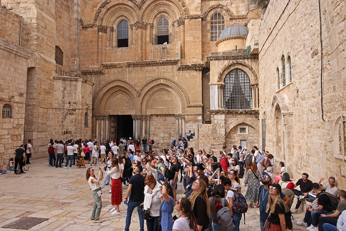 Tourists visit the Church of the Holy Sepulchre in the Old City of Jerusalem. (Getty)