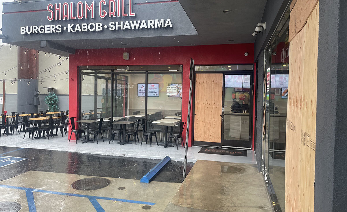Shalom Grill and Sushiko, in the foreground, had boarded up their entrances after an attack on Aug. 19, 2023.