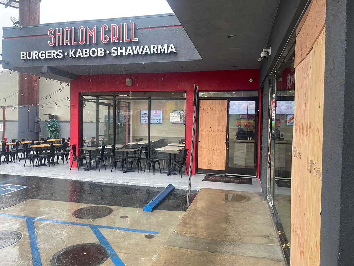 Shalom Grill and Sushiko, in the foreground, had boarded up their entrances after an attack on Aug. 19, 2023.