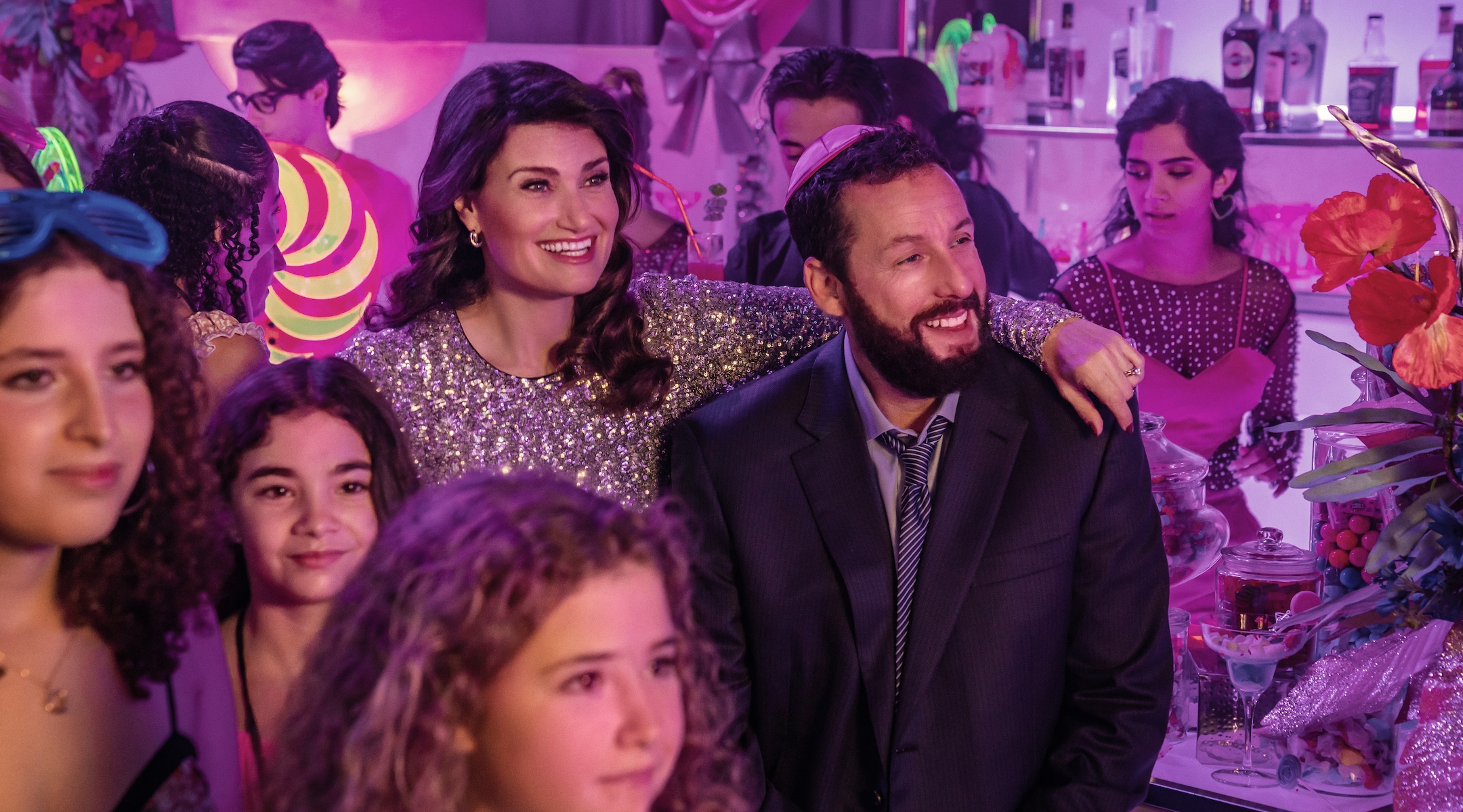 Idina Menzel, Adam Sandler’s co-star in “Uncut Gems,” reunites with him for “You Are So Not Invited To My Bat Mitzvah.” (Scott Yamano/Netflix)