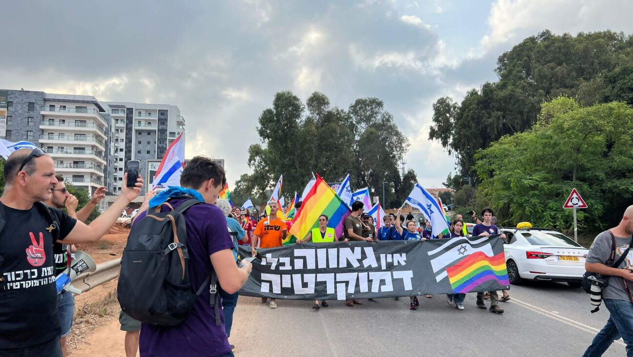 LGBTQ+ rights protesters march through Karkur, a city halfway between Tel Aviv and Haifa.