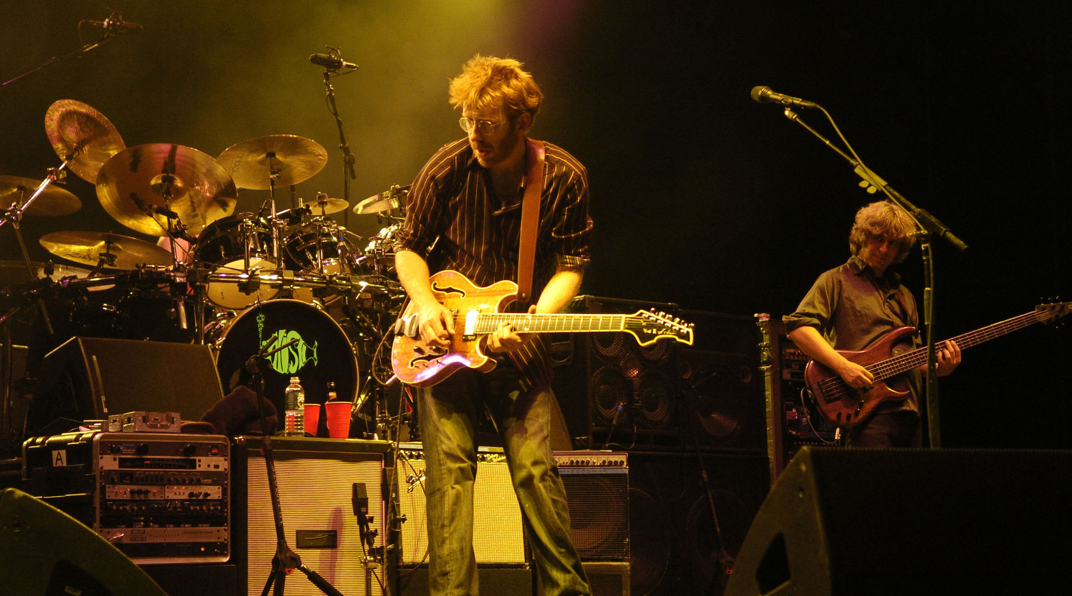 Phish, shown performing in 2004, have cultivated a following that tracks them with religious fervor. (Jeff Kravitz/FilmMagic)