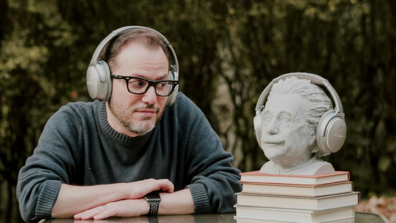 This photo is posed (duh), but Benyamin really does use that Einstein bust to hold extra headphones in his home office in Morgantown, West Virginia. He also has the two authorized Einstein bobbleheads and a 578-page paperback called The Ultimate Quotable Einstein at the ready near his desk. (Photo by Shoshi Benstein)