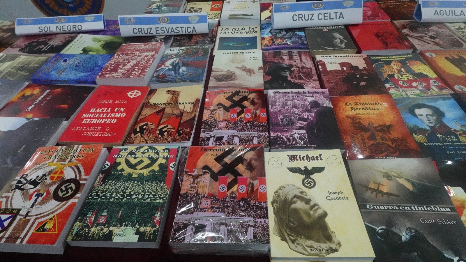 Police display books seized in the raid on Libreria Argentina, accused of selling Nazi propaganda. (Courtesy DAIA)