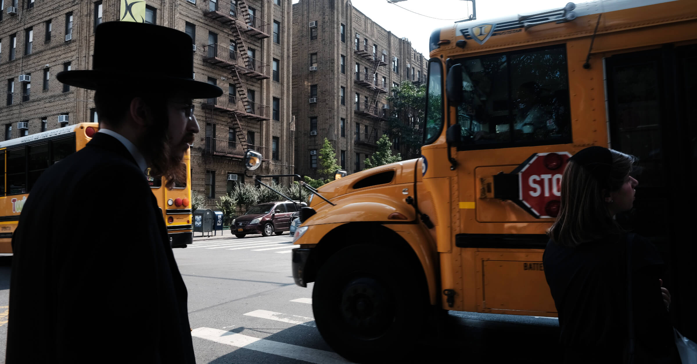 A yeshiva school bus drives through Borough Park in Brooklyn on September 12, 2022.