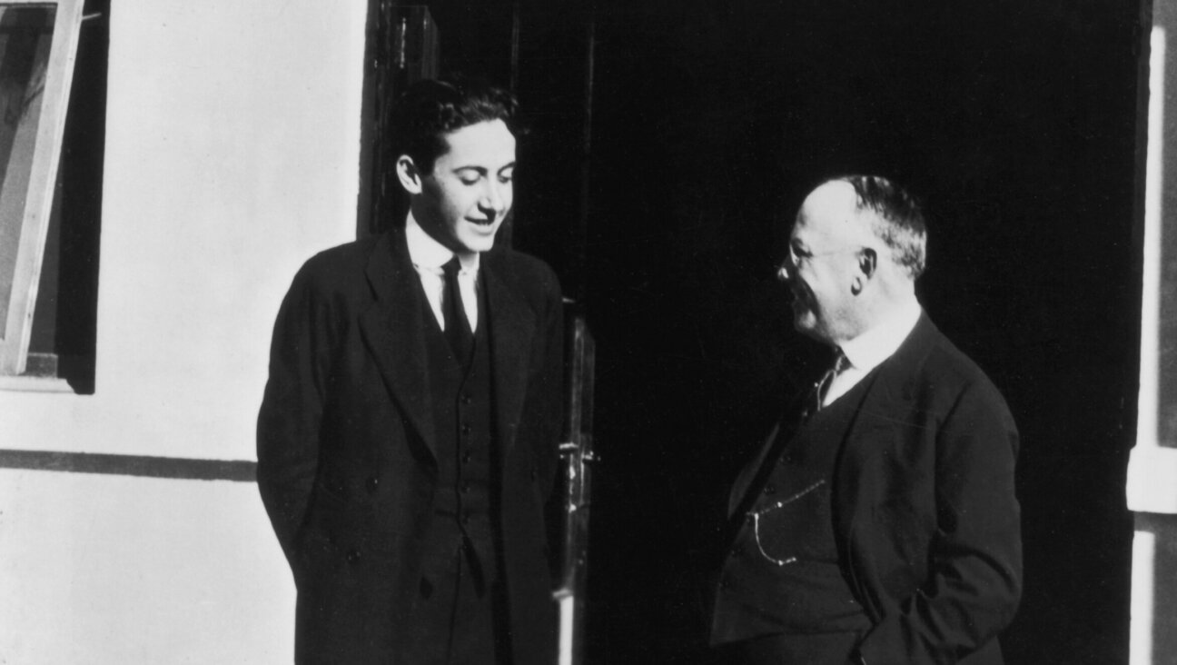 American film producer Irving Thalberg, the child of German Jews (left), speaks with Jewish, German-born film executive Carl Laemmle (right) on the lot of Universal Studios.