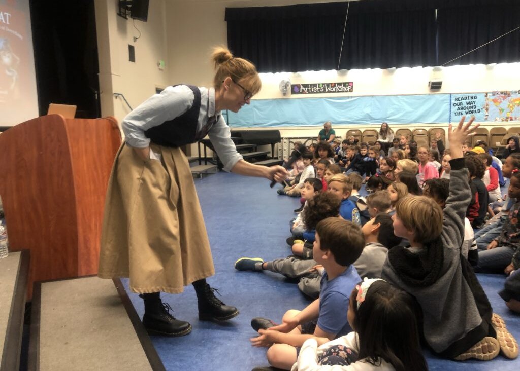 Author Elana K. Arnold interacts with children at an event. Arnold is one of three Jewish writers on PEN America's list of most-banned authors. 
