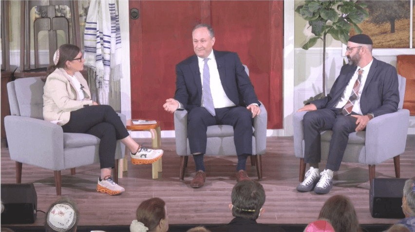 Second gentleman Doug Emhoff, center, is interviewed by Rabbi Lauren Holtzblatt, left, and Rabbi Aaron Alexander at Adas Israel Congregation in Washington, D.C., on  Yom Kippur on September 25, 2023.