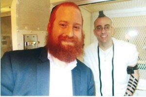Murphy with Chabad Rabbi Dovid Goldstein, who instructed him on using tefillin.