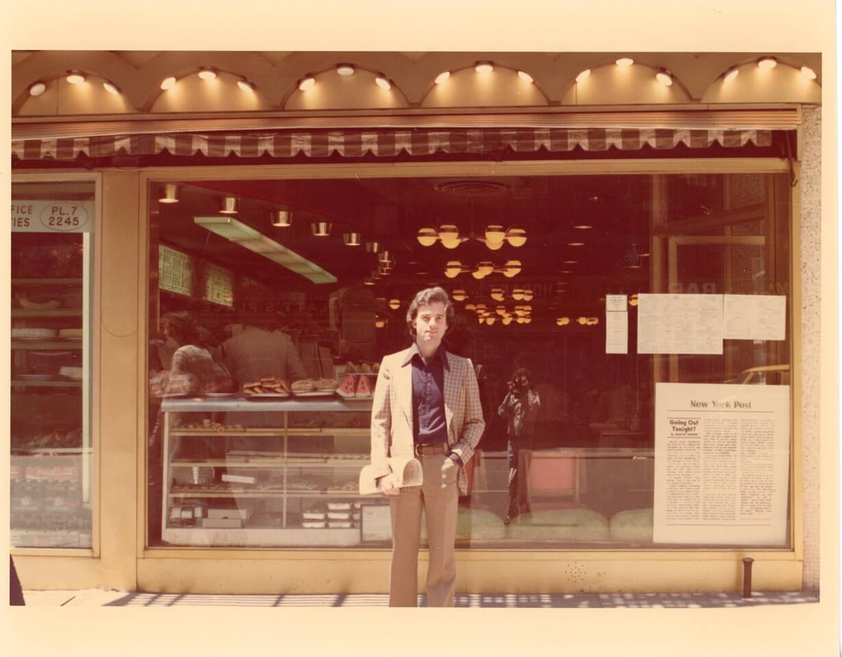 The author outside the Carnegie Deli, circa 1974. Photographer, visible in the window, is writing partner Jim Mullholland.