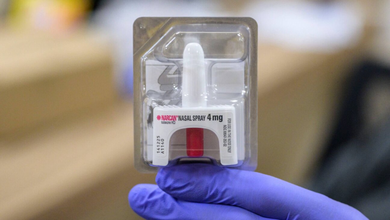 A staff member holds a Narcan nasal spray, used to treat narcotic overdoses in an emergency situation, at St. Ann's Corner of Harm Reduction in New York City on April 24, 2023. 