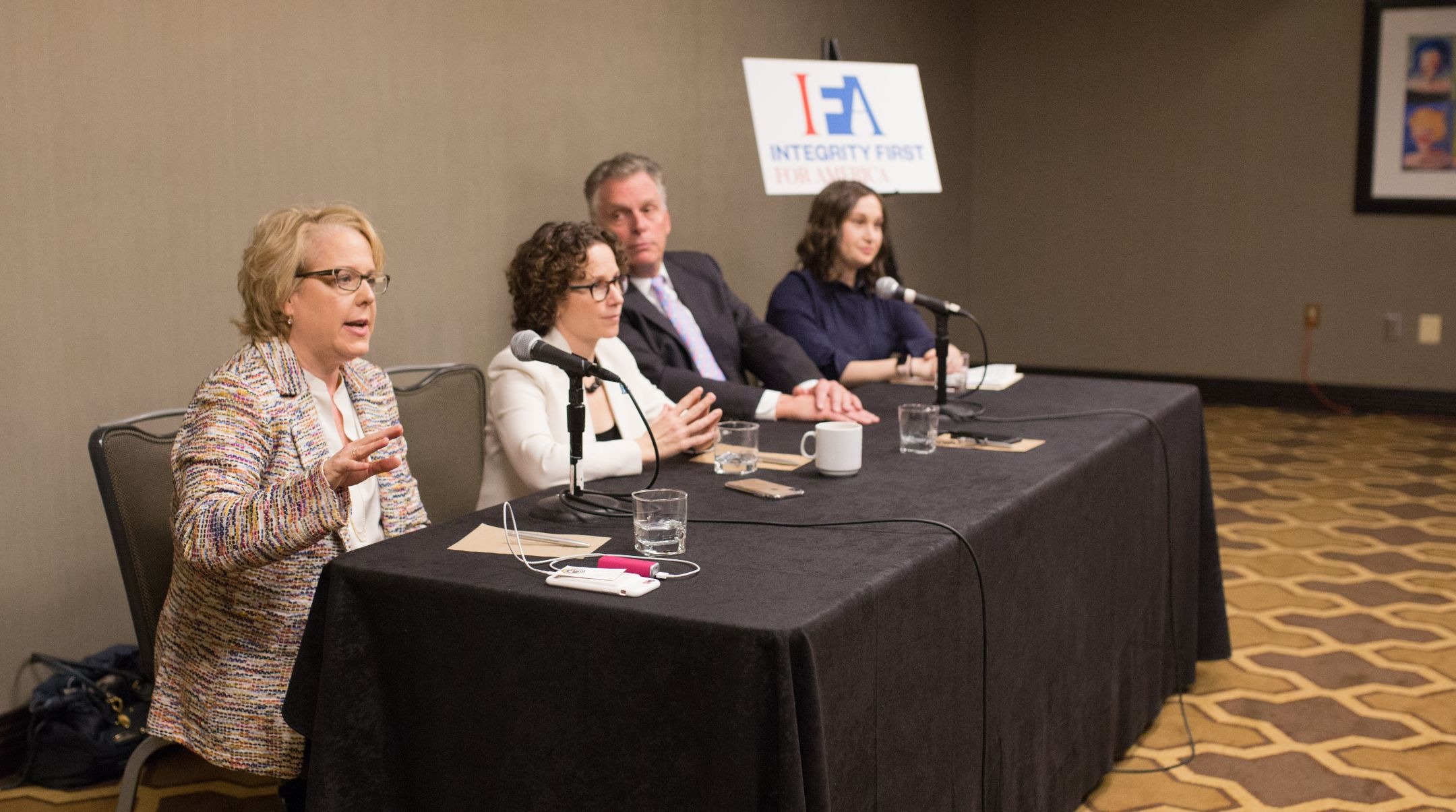 Roberta Kaplan addresses a panel in Washington D.C. about the case her organization, Integrity First for America, is bringing against the organizers of the neo-Nazi 2017 march in Charlottesville, Virginia. Seated left to right are Kaplan, her co-counsel, Karen Dunn, former Virginia Gov. Terry McAuliffe, and IFA executive director, Amy Spitalnick. (IFA/Emily Goodstein)