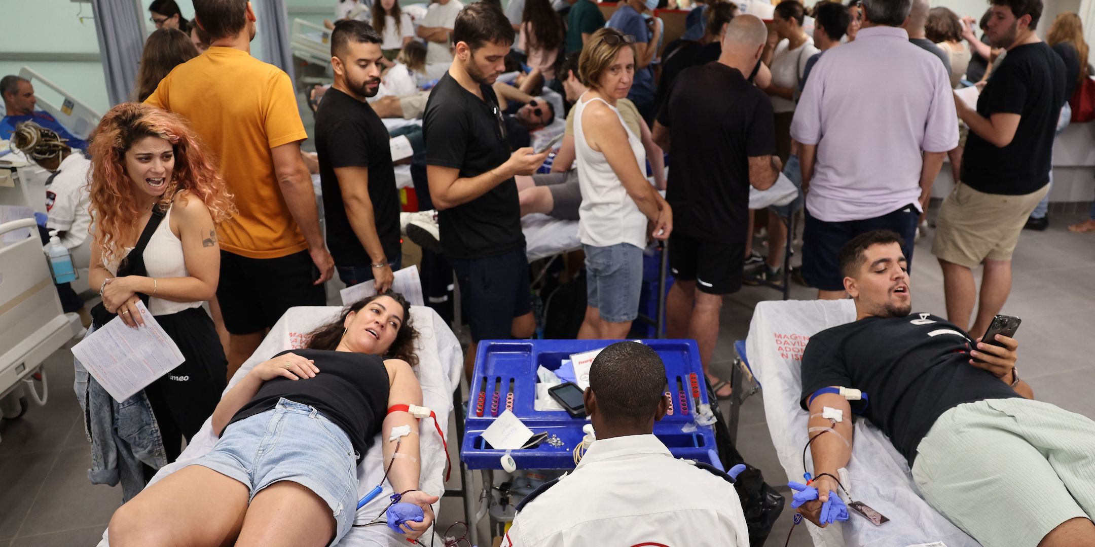 Israelis donate blood at a hospital in Tel Aviv after a barrage of rockets were fired and fighters from the Gaza Strip infiltrated Israel, Oct. 7, 2023. (Jack Guez/AFP via Getty Images)