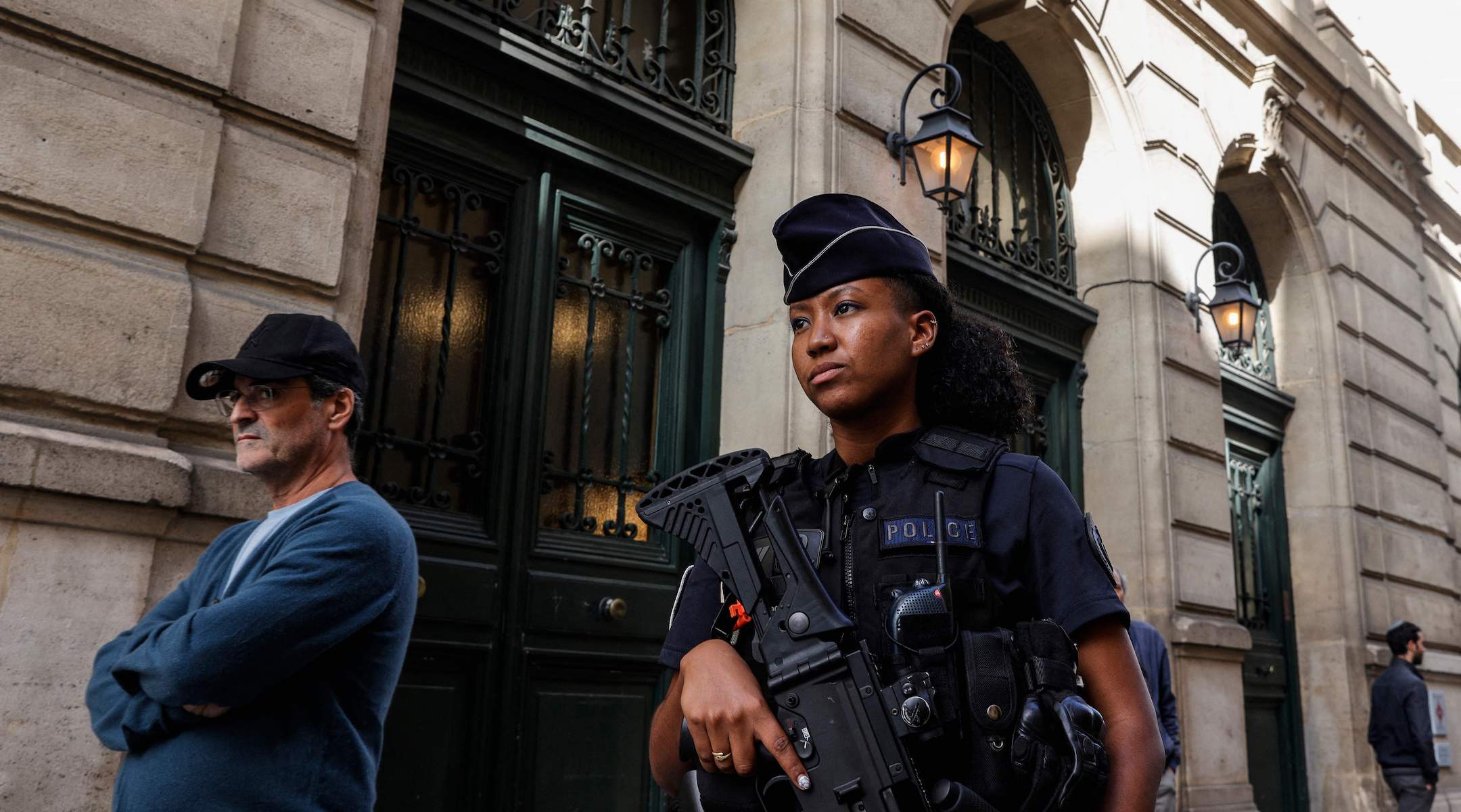 A French police officer patrols outside the Tournelles Synagogue in Paris after increased security measures were put in place at Jewish temples and schools, Oct. 8, 2023. (Geoffroy van der Hasselt/AFP via Getty Images)